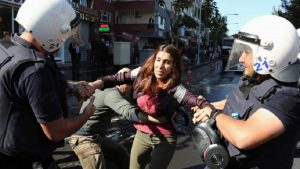 Riot police detain a demonstrator during a protest against the arrest of the city's popular two joint mayors for alleged links to terrorism, in the Kurdish city of Diyarbakir, Turkey, October 26, 2016.